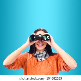 Woman Looking Through Binoculars Isolated On Blue