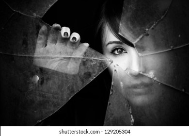 Woman Looking Through Dirty Broken Glass