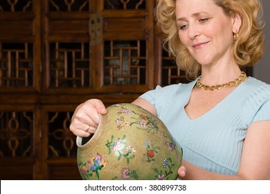 Woman looking at a vase