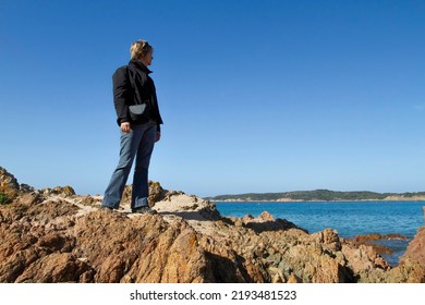 Woman Looking For The View On A Corsica Coast.