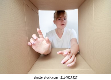 The Woman Looks Into The Delivery Box. Fan