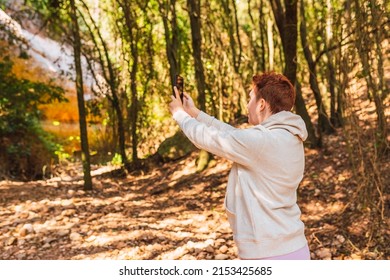 Woman Lost In The Forest, Searching For Reception Signal For Her Smart Phone. Accident On Vacation.