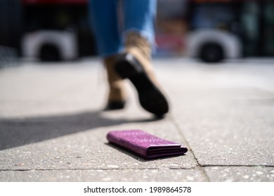 Woman Lost Personal Wallet With Money. Walking On Street