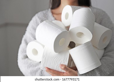 Woman With Lots Of Toilet Paper