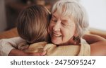 Woman, love and hug senior mom in home for mothers day, bonding and visit in retirement with care or happy. Person, smile and embrace with elderly parent for reunion, comfort and affection in hospice