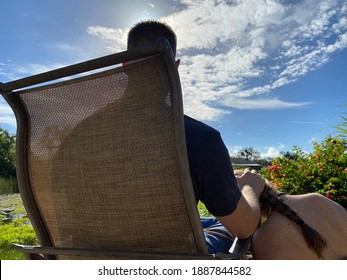 Woman Lovingly Kneeling Beside Man