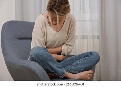 Woman with low abdominal pain. Gynecology, period, female health care, digestive system, Urinary Tract Infections - Shutterstock ID 2165036401