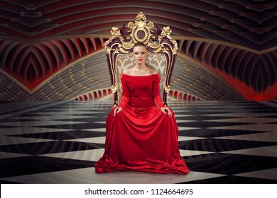 A Woman In A Luxurious Gown Dress Sitting On A Queen's Throne