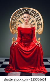 A Woman In A Luxurious Red Dress Sitting On A Golden Throne