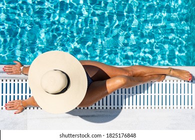 Woman In Luxury Five Stars  Spa Resort In The Swimming Pool. 