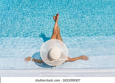 Woman In Luxury Five Stars  Spa Resort In The Swimming Pool. 