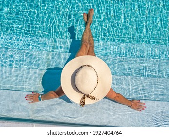Woman In Luxury Five Stars  Spa Resort In The Swimming Pool. 