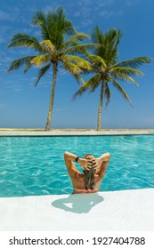 Woman In Luxury Five Stars  Spa Tropical Resort In The Swimming Pool. 