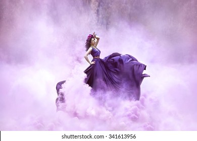 woman in luxury lush long purple dress swirls fly waving in smoke, fantastic shot, fairytale princess walking in autumn forest, fashion glamour design, creative violet color. White Cloud Show Theater