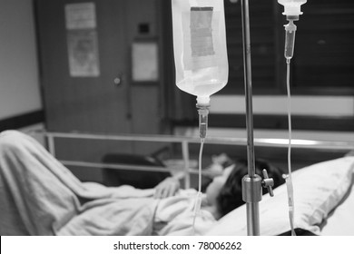 Woman Lying Down In Hospital Bed