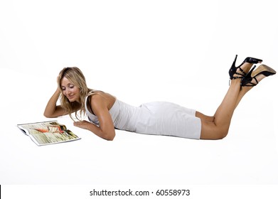 Woman Lying Down Reading Magazine