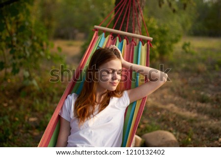 woman lying in a hammock in nature                          