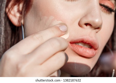 Woman Make up cosmetics / Beautiful young girl make up face powder personally outdoors