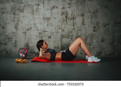 Woman Makes An Abs Workout