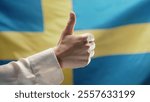 Woman Makes Hand Sign Like, Thumb Up Gesture on swedish flag background. Sweden, correct Perfect Choice, Great Deal. Sverige positive, approval, trust concept. High quality 