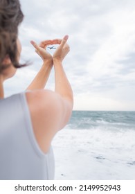 Woman Makes Heart Symbol With Flying Plane In It. Romantic Gesture Of Wanderlust. Travel By Plane Concept. 