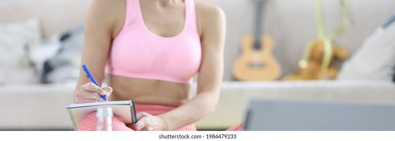 Woman Makes Home Workout Plan In Diary