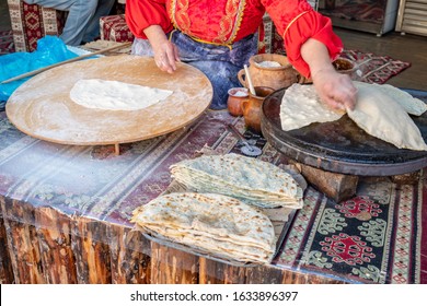 Woman Making Azerbaijan Qutab With Greens. Traditional Food.