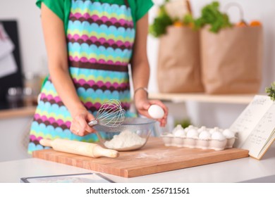 Woman Is Making Cakes In The Kitchen