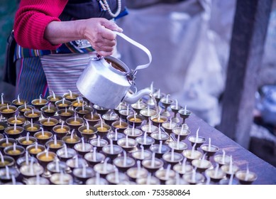 Woman Making Candles For The Prayer