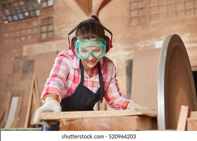 Woman Making Carpenter Apprenticeship And Working With Grinder