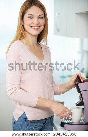 woman is making coffee at home