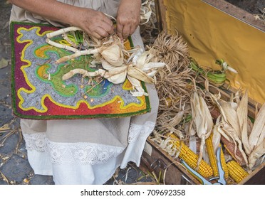 Woman Making A Corn Husk Doll