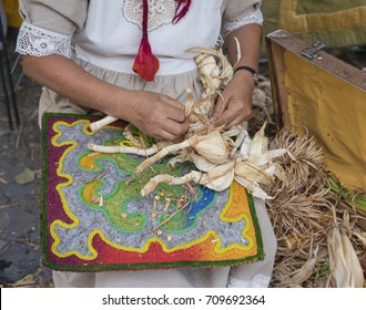 Woman Making A Corn Husk Doll