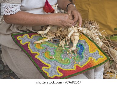 Woman Making A Corn Husk Doll