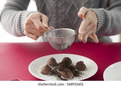 A Woman Making Delicious Truffle Chocolate