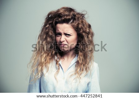 Woman making a disgusted expression. Filtered image