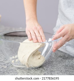 Woman Making Dough In The Kitchen At Home