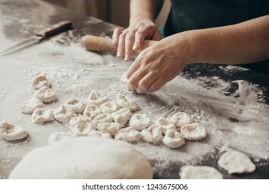 Woman Making Dumplings On Table