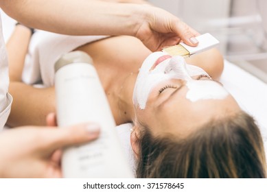 Woman Making Facial Treatment In A Beauty Saloon