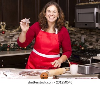 Woman Making Ginger Bread Cookies In The Kitchen