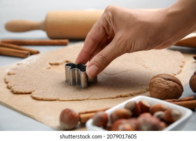 Woman Making Gingerbread Man With Cutter At Table, Closeup. Homemade Christmas Biscuits