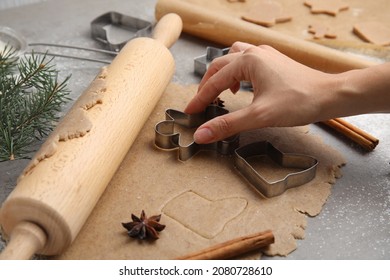 Woman Making Gingerbread Man With Cutter At Table, Closeup. Homemade Christmas Biscuits