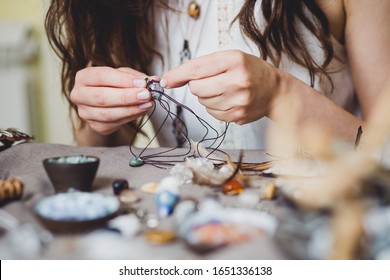 Woman making handmade gemstone jewellery, home workshop. Artisan woman creates jewellery. Art, hobby, handcraft concept - Powered by Shutterstock