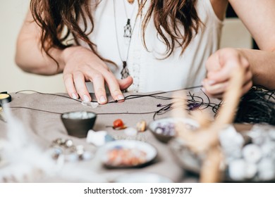 Woman making handmade gemstone jewelry, home workshop. Artisan woman creates jewelry. Art, hobby, handcraft concept