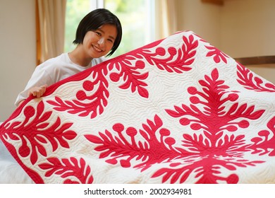 A Woman Making A Hawaiian Quilt 
