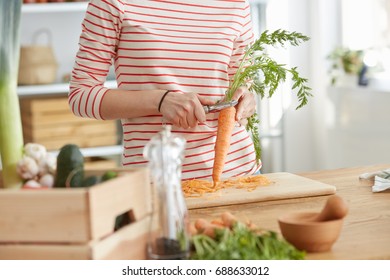 Woman Making Healthy Carrot Soup With Bio Vegetables