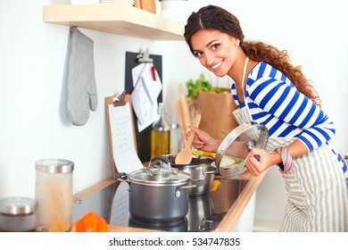 Woman Making Healthy Food Standing Smiling In Kitchen