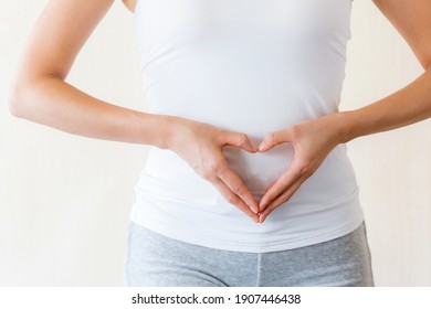 Woman Making Heart On Tummy.