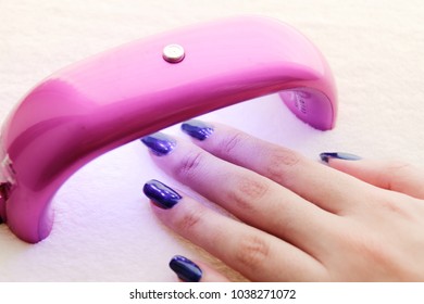 Woman Making Her Nails Using Hybrid Lamp