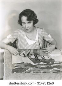 Woman Making A Hooked Rug